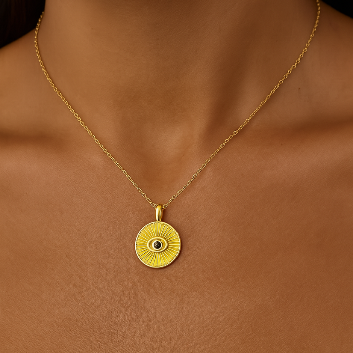 eye ray gold necklace on model