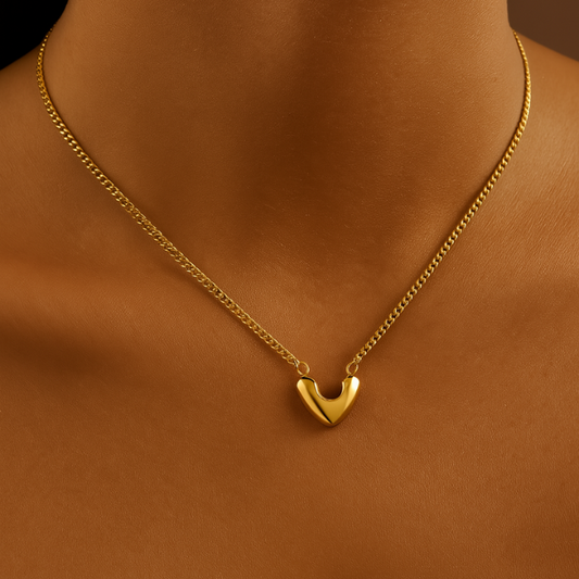 heart sculpt gold necklace on model