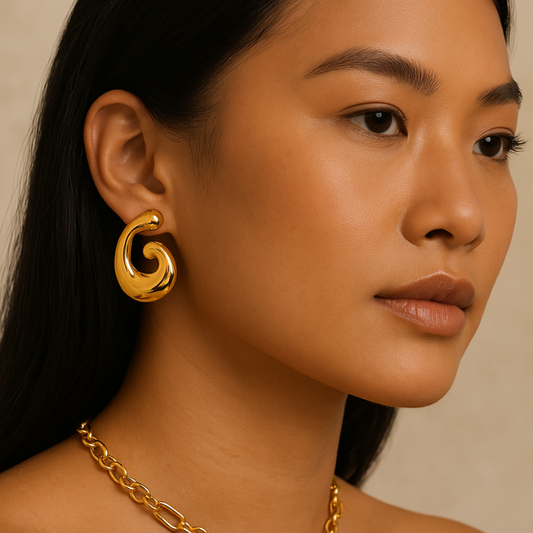 irregular geometric gold earrings on model