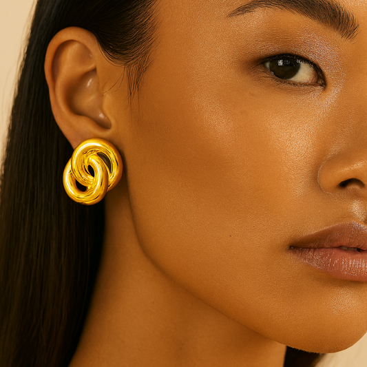 knotted gold earrings on model