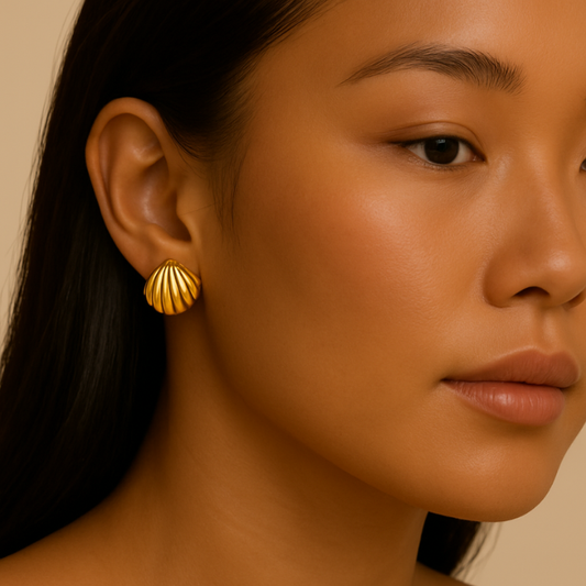 shell gold stud earrings on model